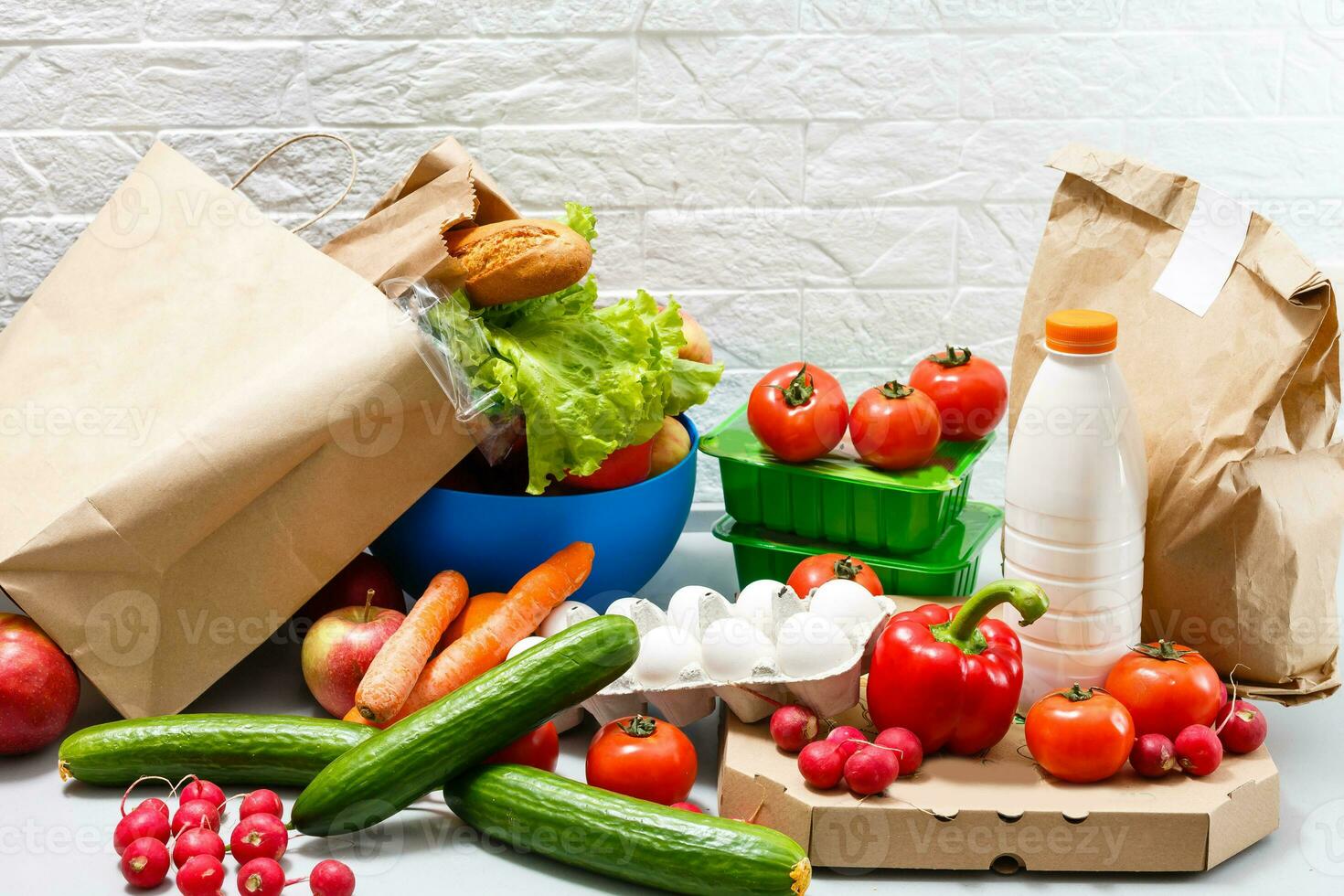 Different set of products to order in paper bags on white background photo