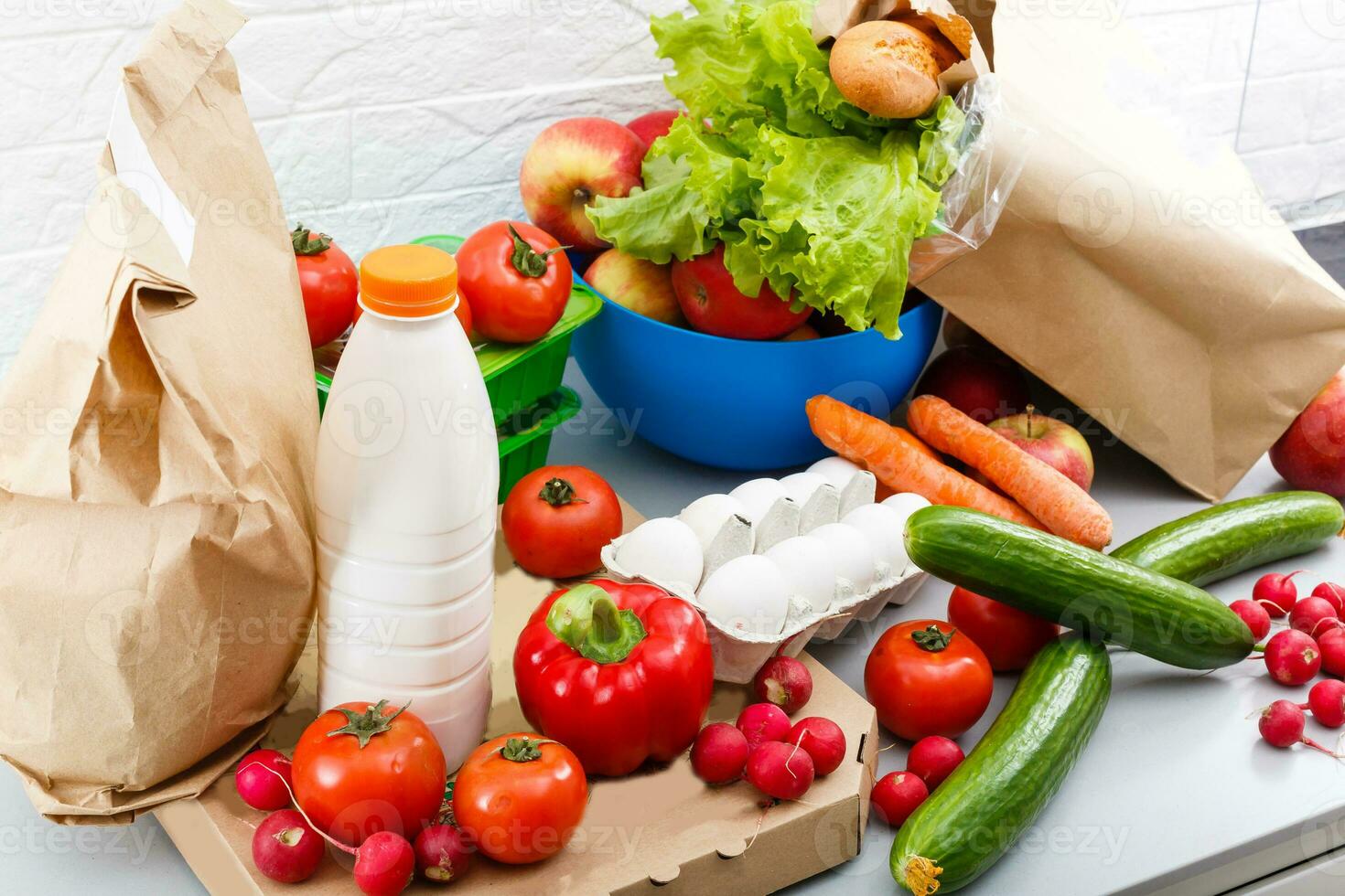 Different set of products to order in paper bags on white background photo
