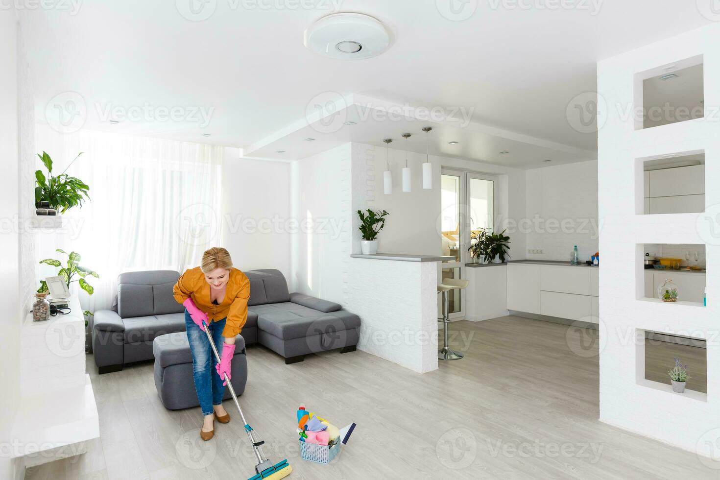 Young woman doing housework, cleaning photo