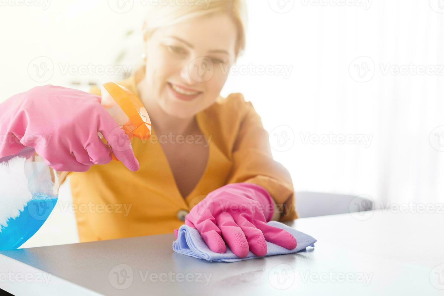 Smiling worth girl with the equipment for cleaning photo