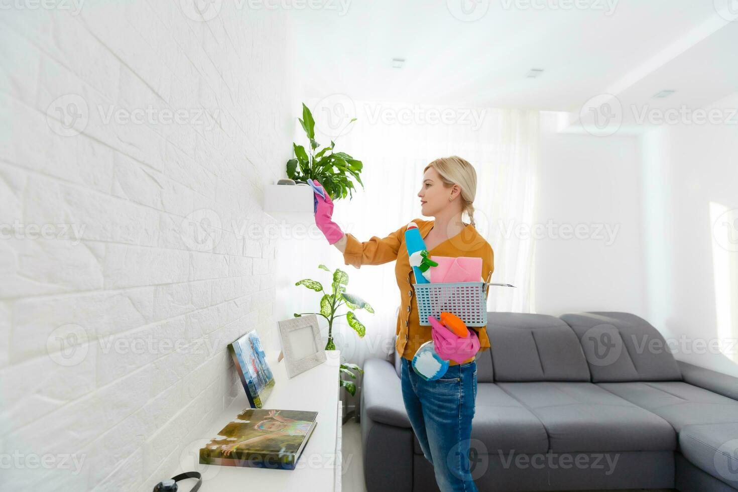 Young woman doing housework, cleaning photo