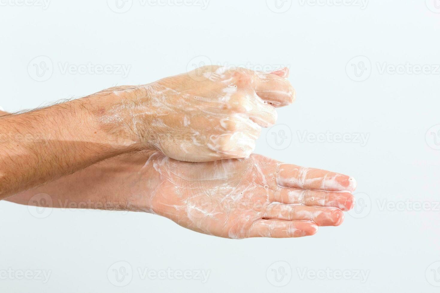 man washing hands isolated over white background photo