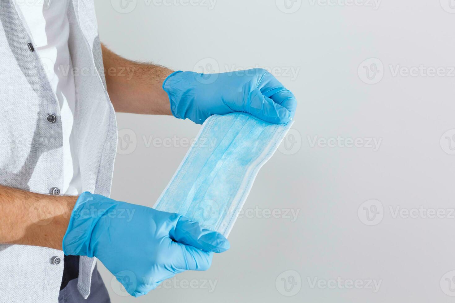 Hand give to surgical mask for protect PM 2.5 and corona virus isolated on white background with clipping path photo