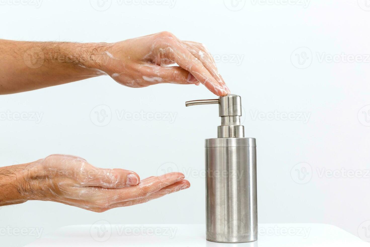 man washing hands isolated over white background photo