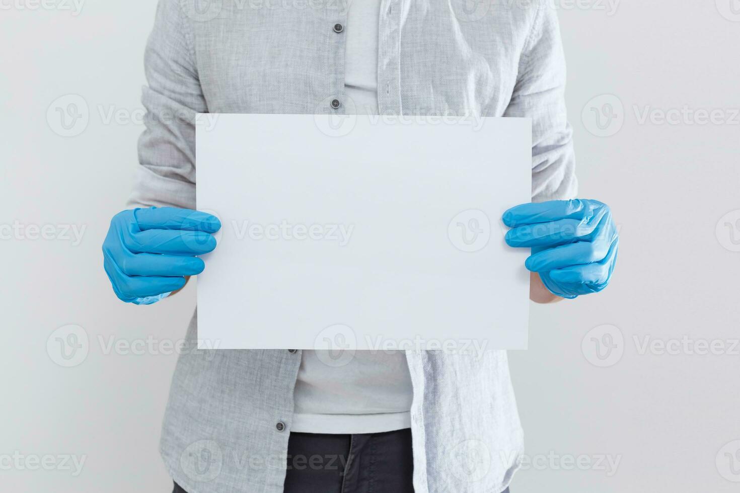 Butler or concierge hand holding blank note. Horizontal format arm with hand outstretched from right side isolated on white. photo