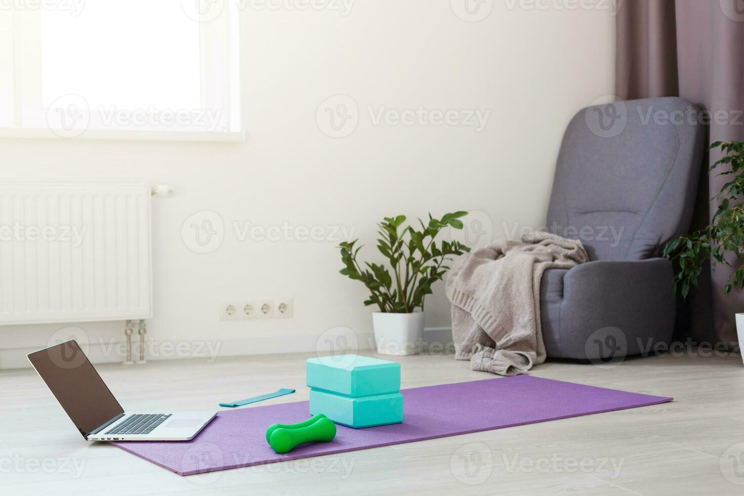 Front view of a laptop with blank copy space screen, yoga at home photo
