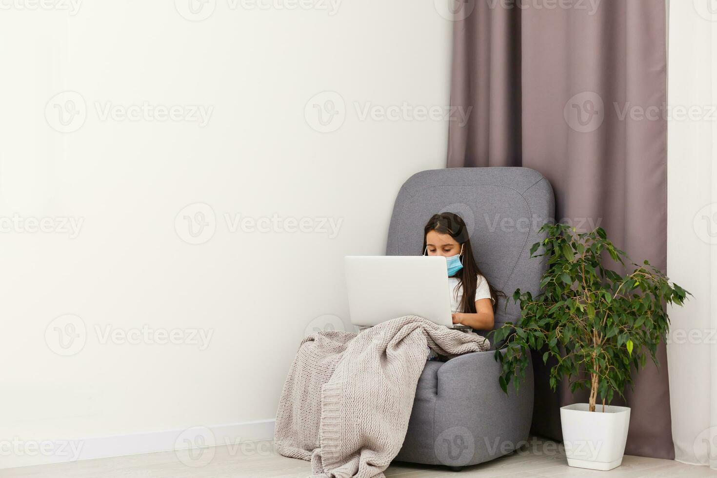Covid-19 Coronavirus and Learning from home concept. a girl study with online learning with laptop. Quarantine and Social distancing concept. photo