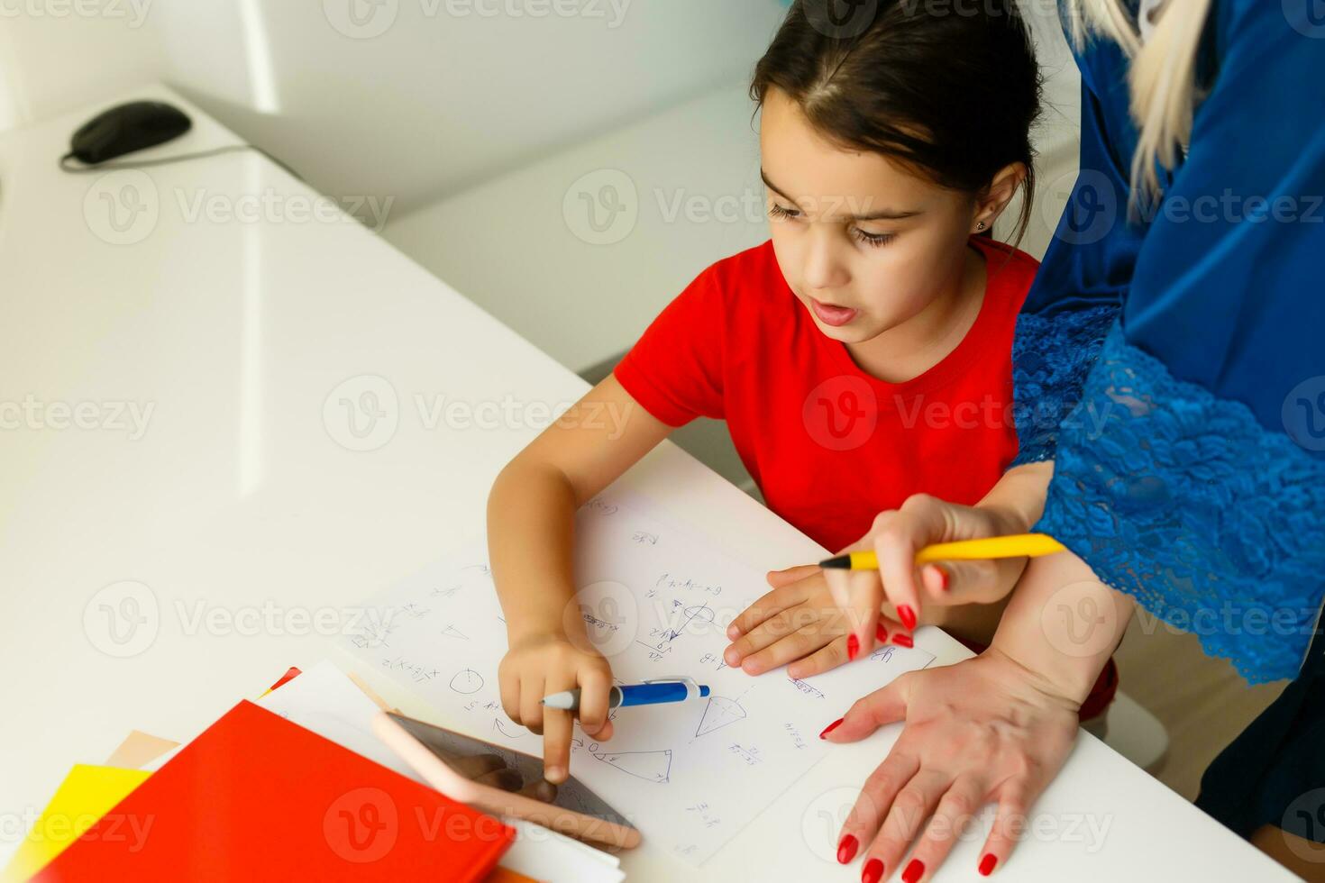 little girl with mom studies online photo