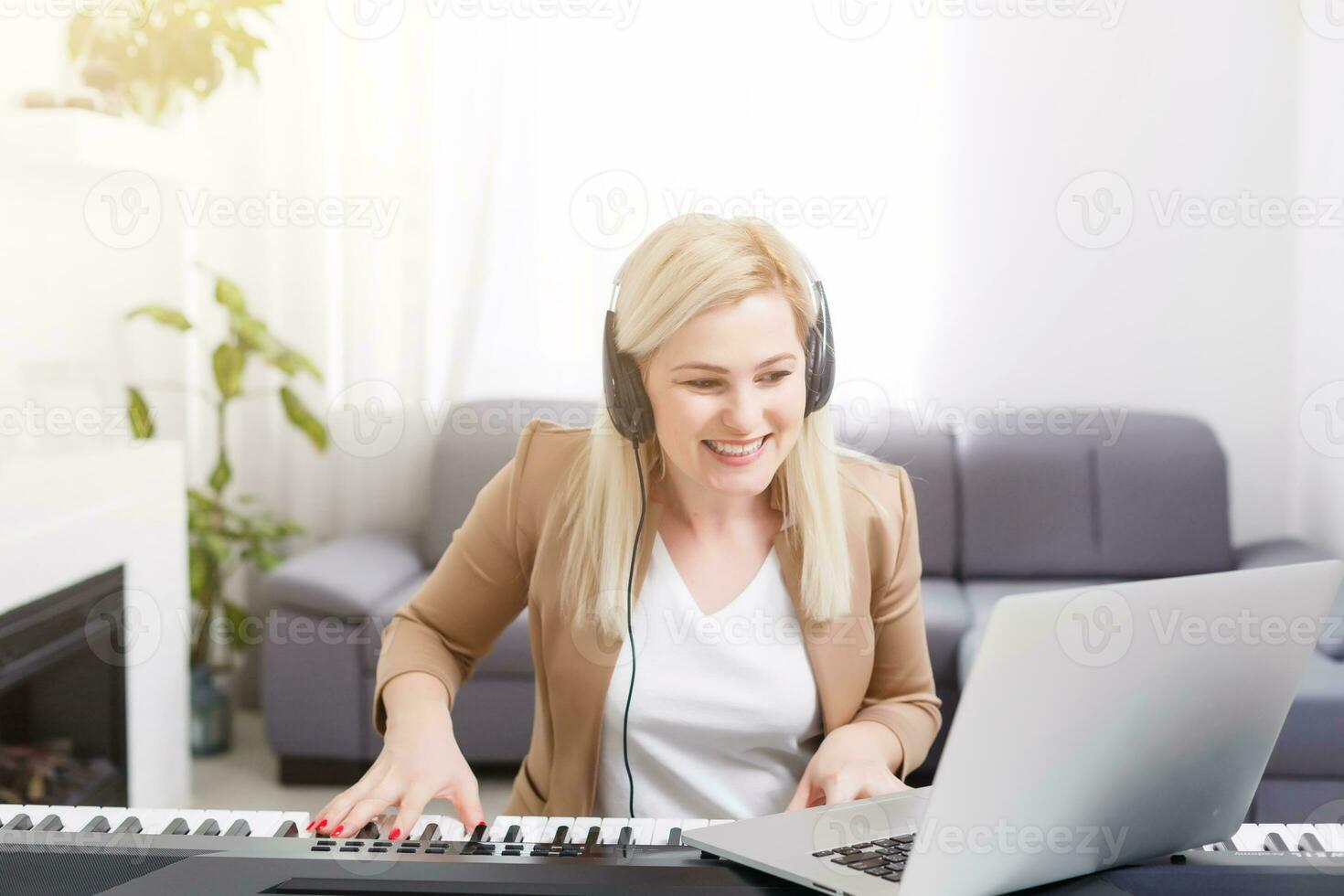 woman having video chat with friends and playing music photo