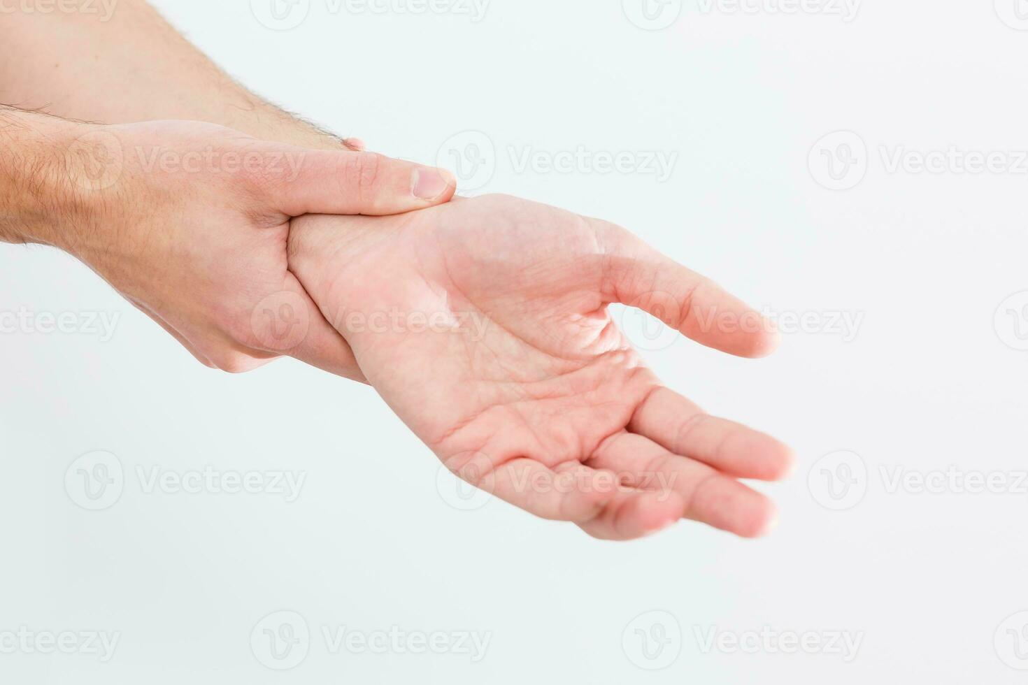 man's wrist hurts. A damaged female hand hurts. Hands suffer from work, sports injury. Sore spot is highlighted in red. Isolated white background. photo