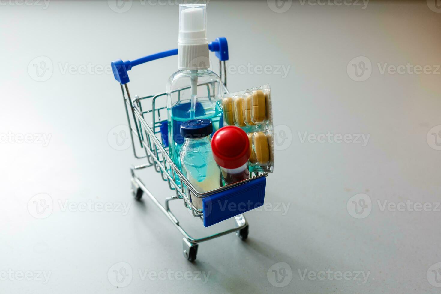 Full shopping cart of pills on white background. photo