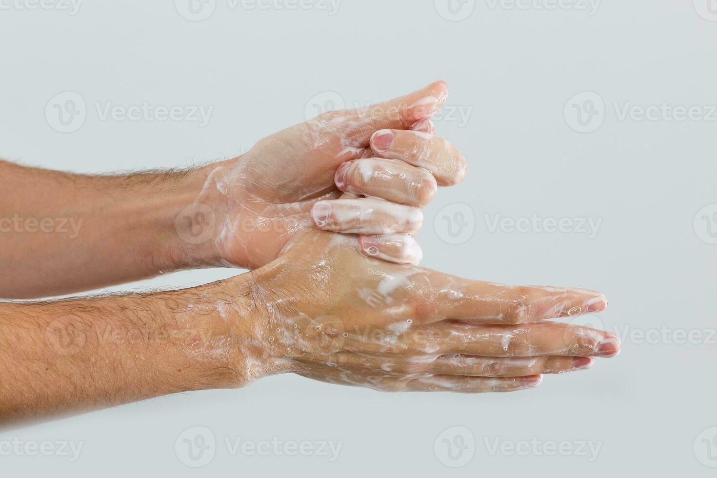 Close up image of washing hand against white background photo