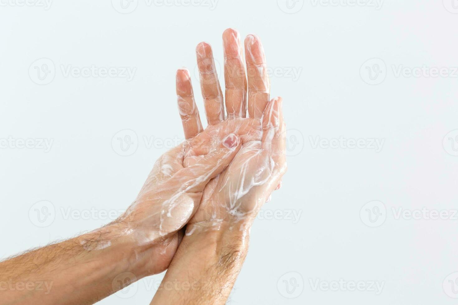 Close up image of washing hand against white background photo