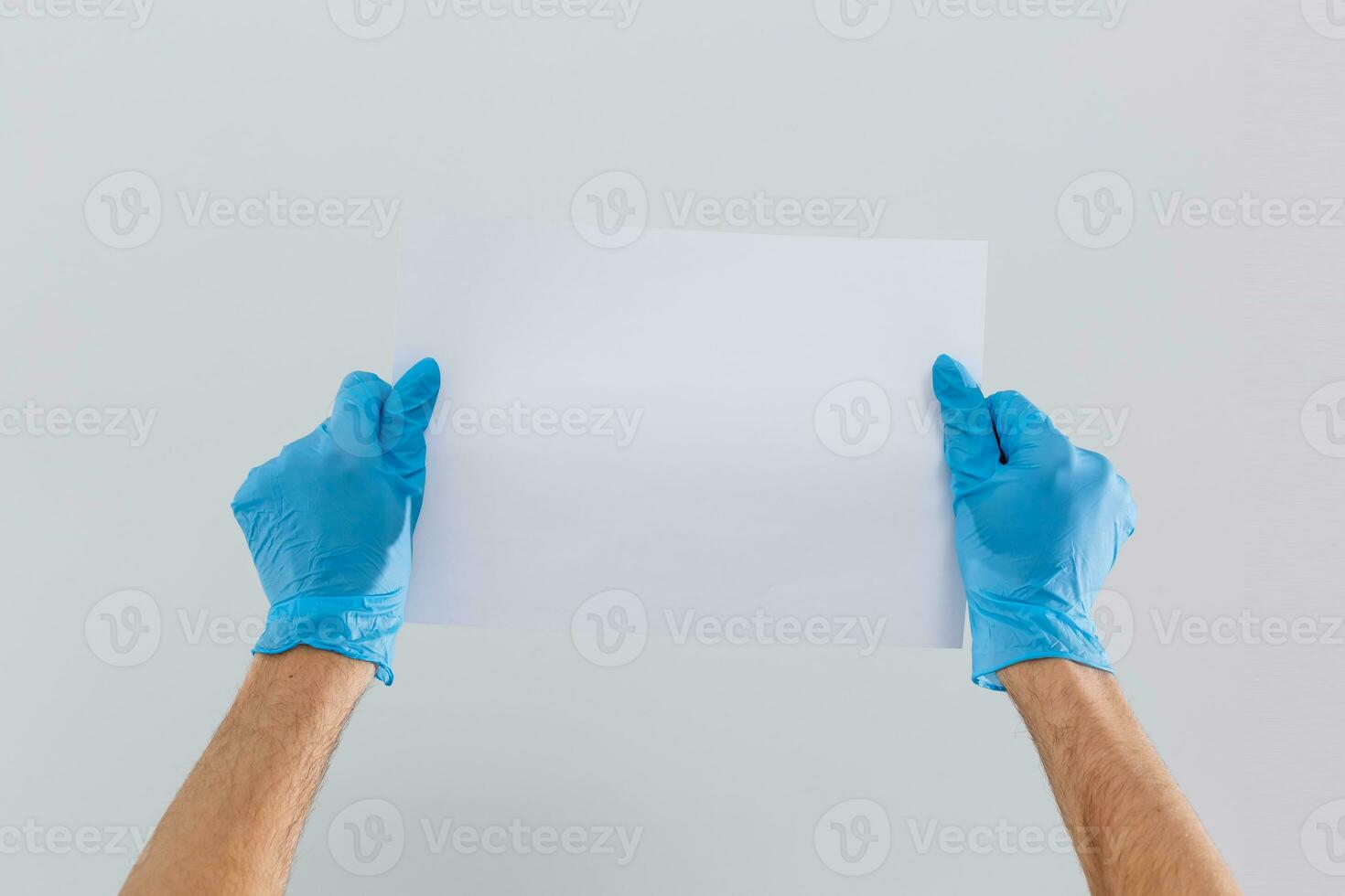 Butler or concierge hand holding blank note. Horizontal format arm with hand outstretched from right side isolated on white. photo