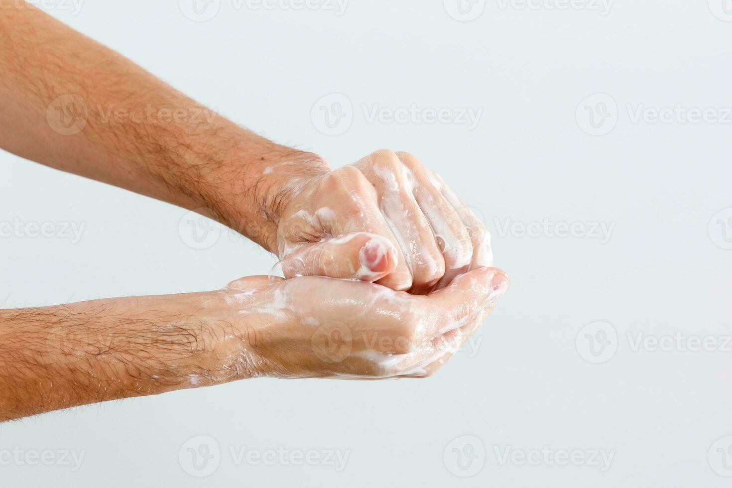 Close up image of washing hand against white background photo