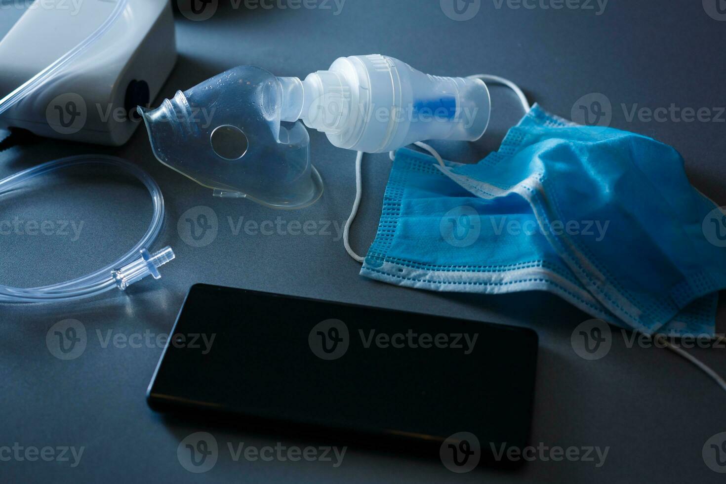 Compressor nebulizer with mask on table photo