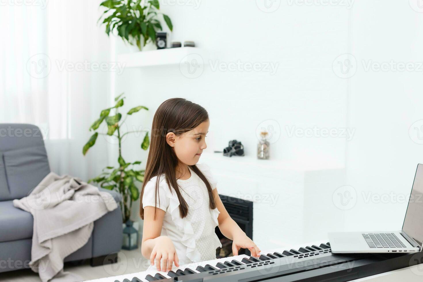 Scene of piano lessons online training or E-class learning while Coronavirus spread out or covid-19 crisis situation, vlog or teacher make online piano lesson to teach students pupils learn from home. photo