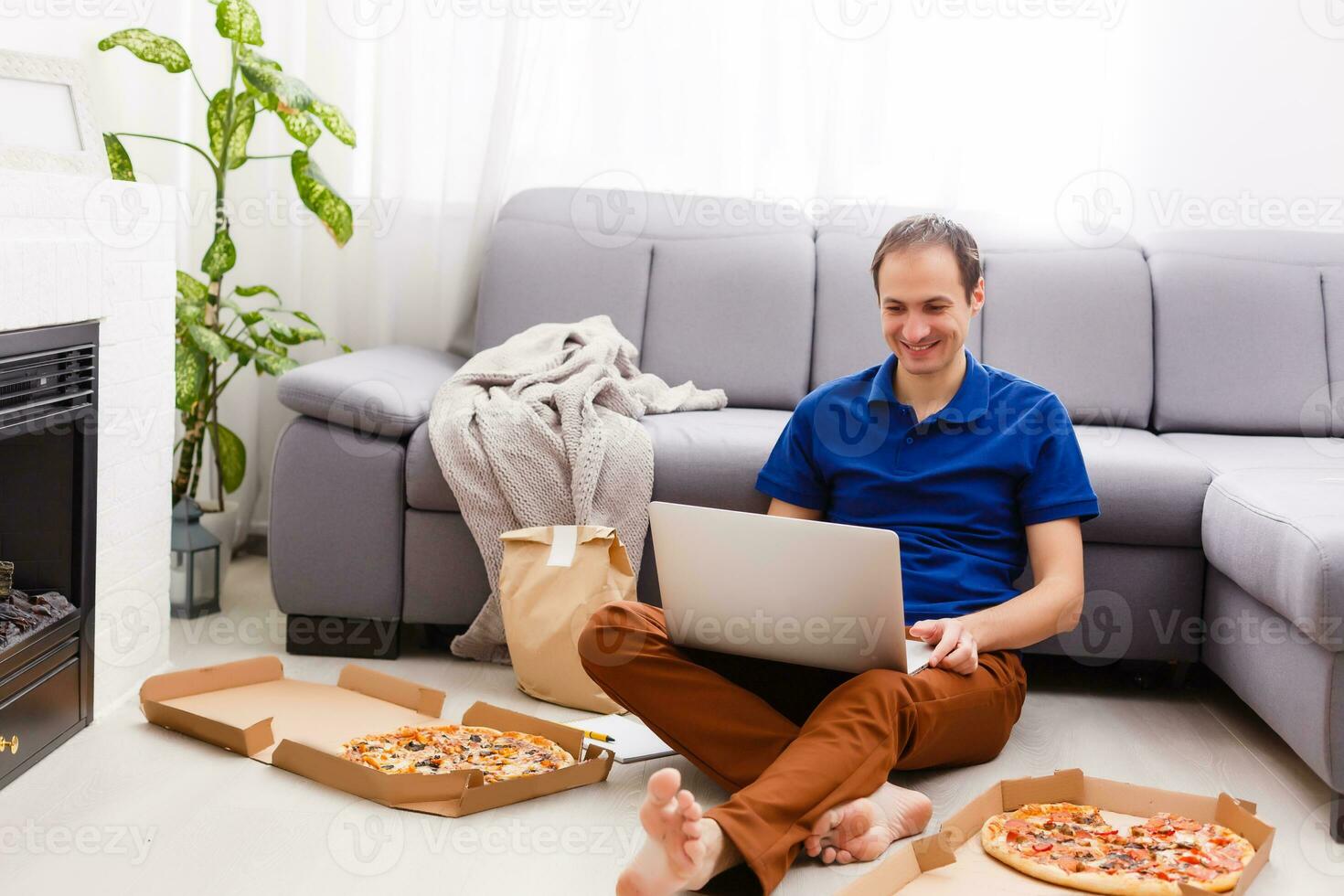 Man using laptop for online food order during quarantine, closeup. Delivery service photo
