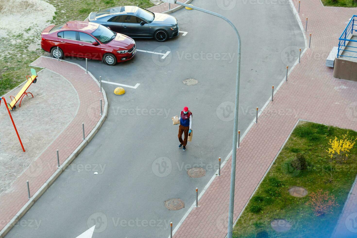 Selected focus, European people queue on street outside supermarket during quarantine for COVID19 virus in photo