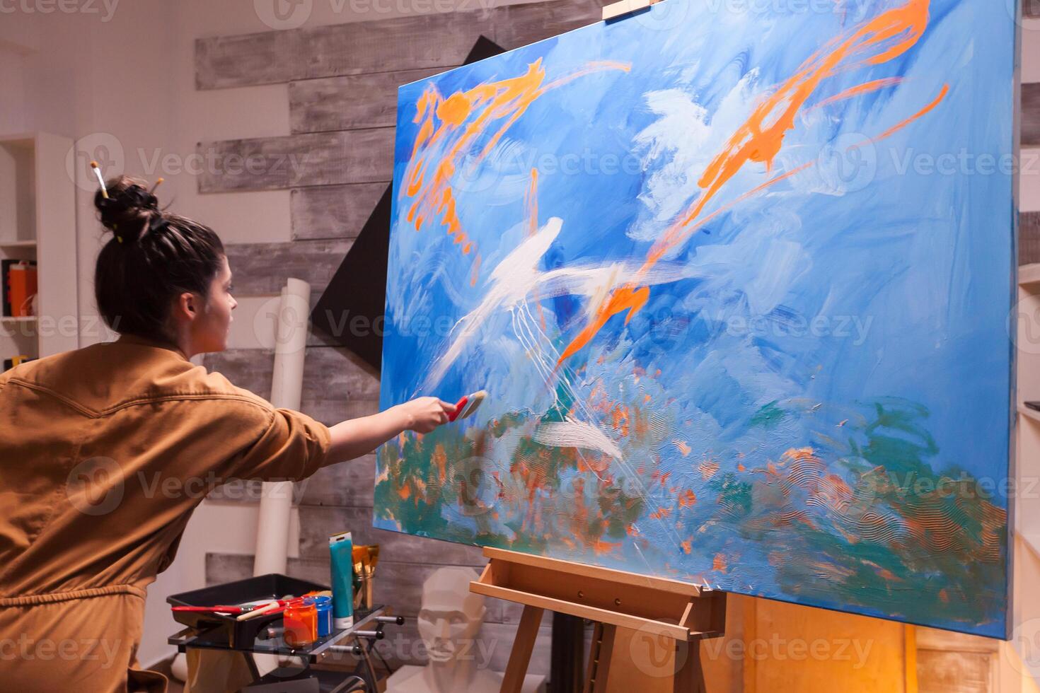Successful artist painting in art workshop with innovative imagination. Modern artwork paint on canvas, creative, contemporary and successful fine art artist drawing masterpiece photo