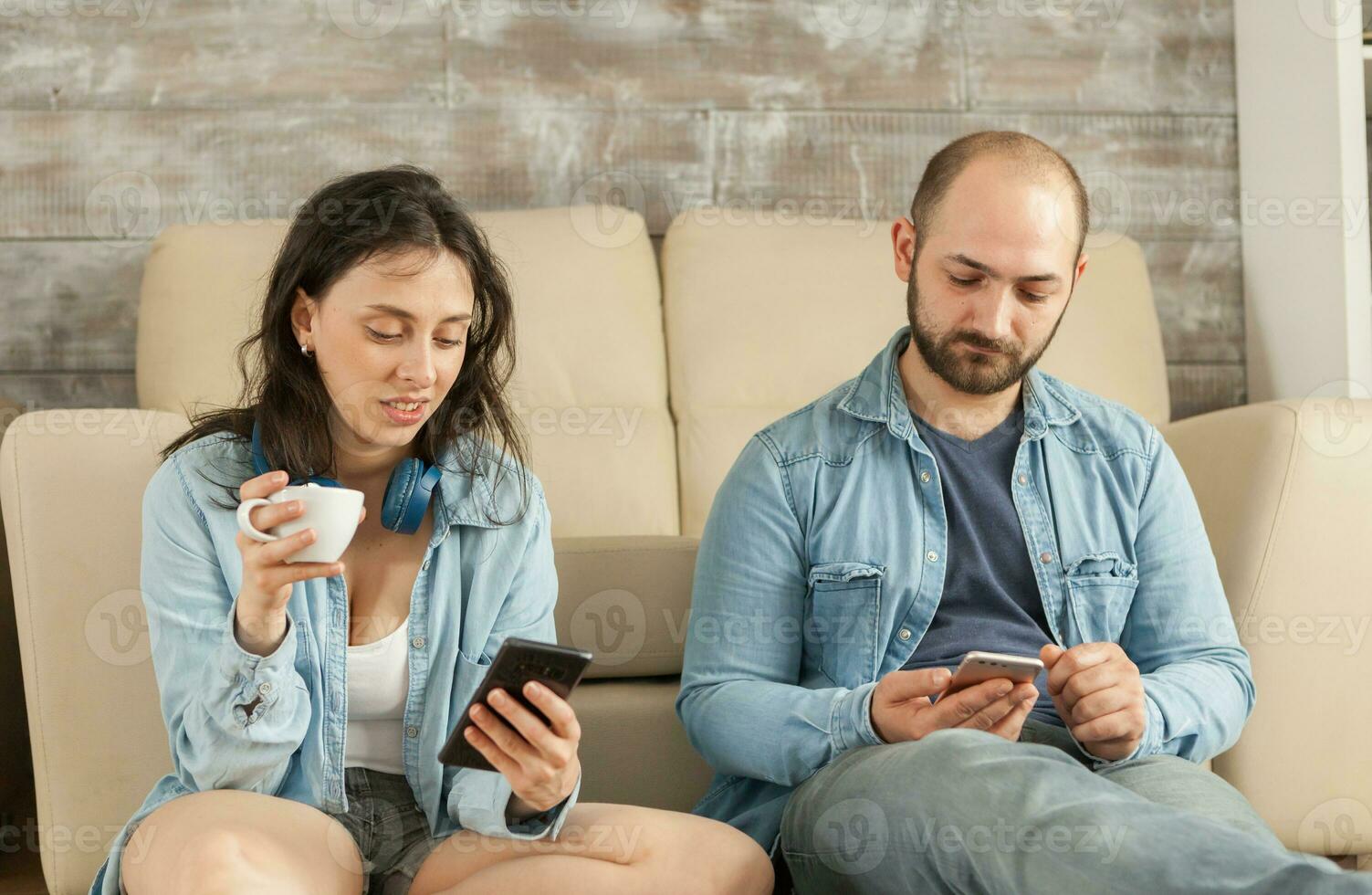 Young married couple relaxing in living room. photo