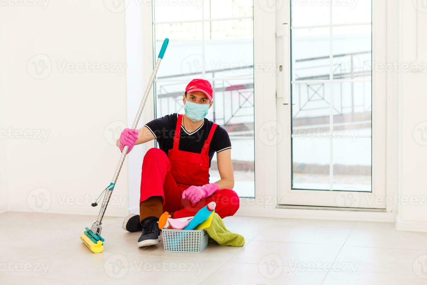 Cleaning and Disinfection at town complex amid the coronavirus epidemic. Professional teams for disinfection efforts. Infection prevention and control of epidemic. Protective suit and mask photo