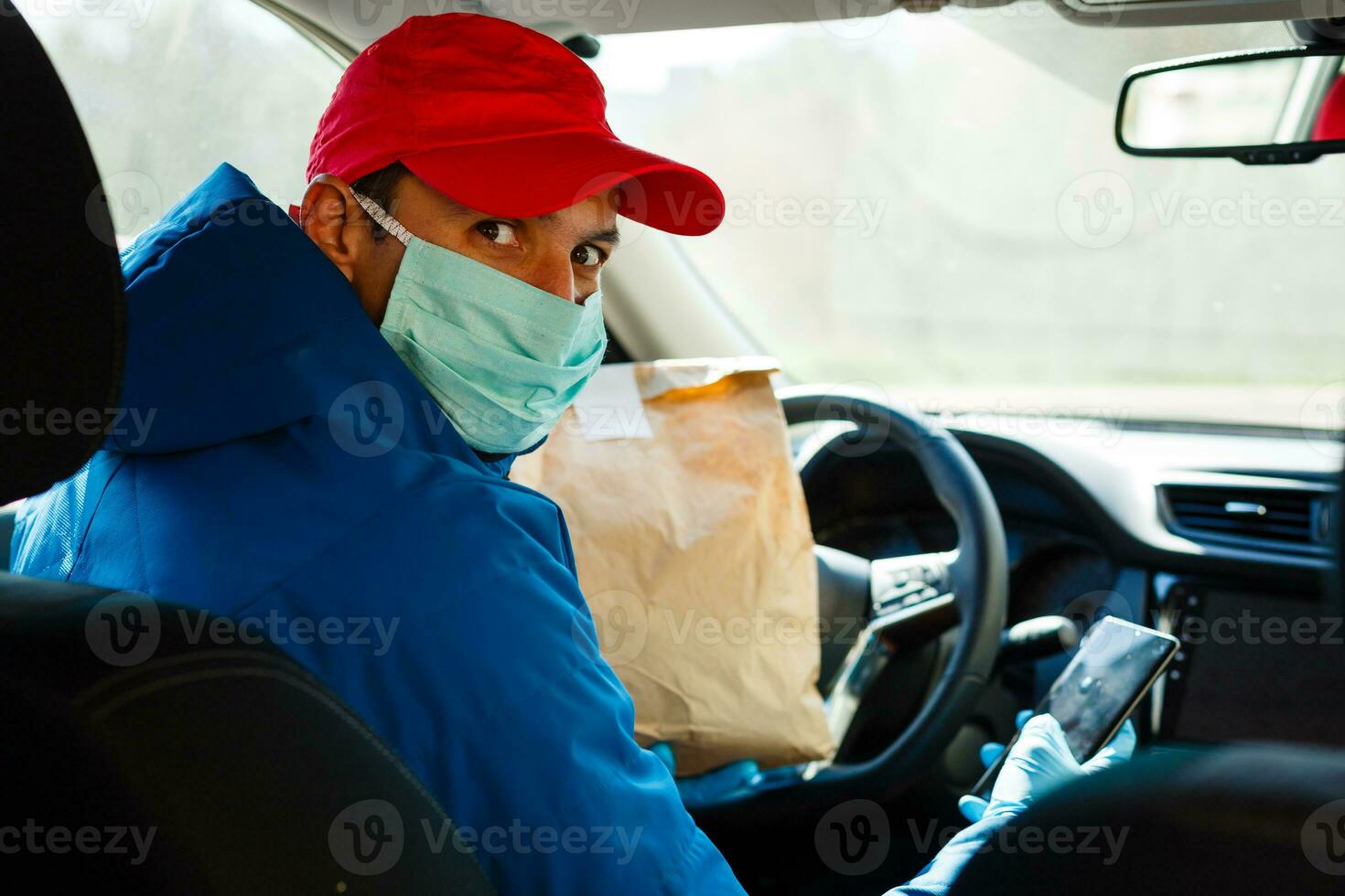 food delivery man Wearing Medical Mask. Corona Virus Concept photo