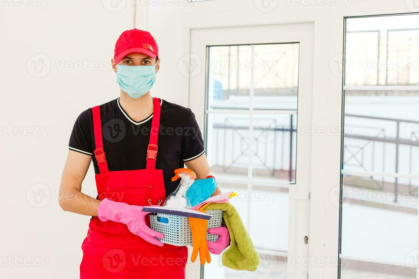 Disinfection For Virus Killing. Worker in Protection Mask cleaning Interior Using Chemical Agents To Stop Spreading Virus Infections. photo