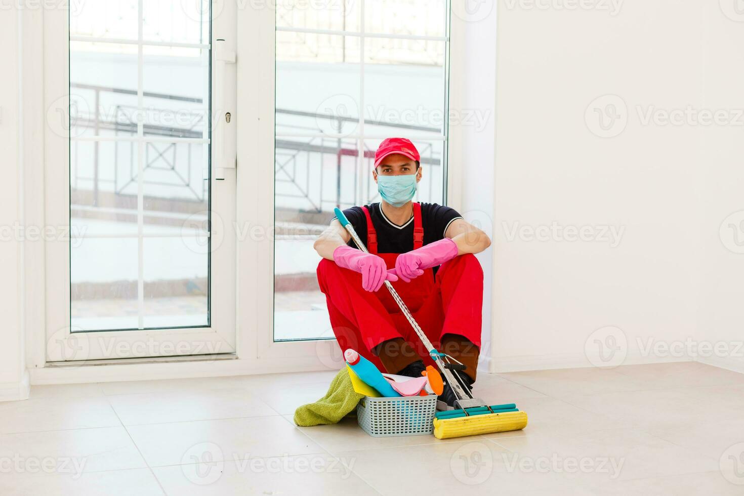 Disinfection For Virus Killing. Worker in Protection Mask cleaning Interior Using Chemical Agents To Stop Spreading Virus Infections. photo