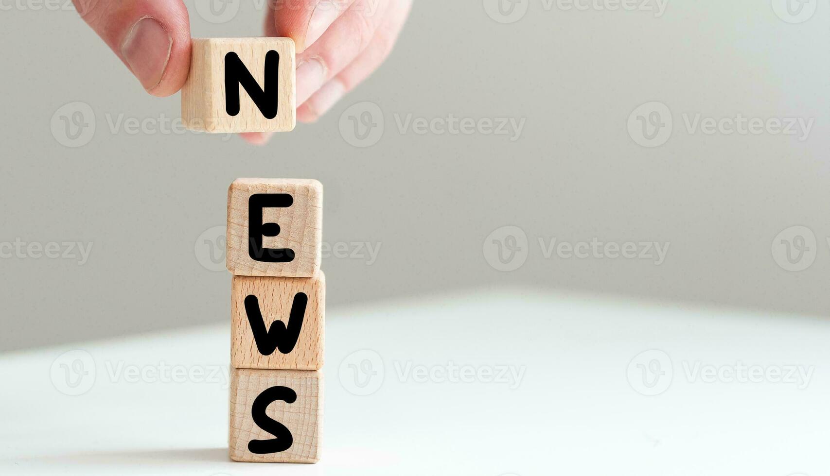 news text in black letters on wooden blocks social media concept photo