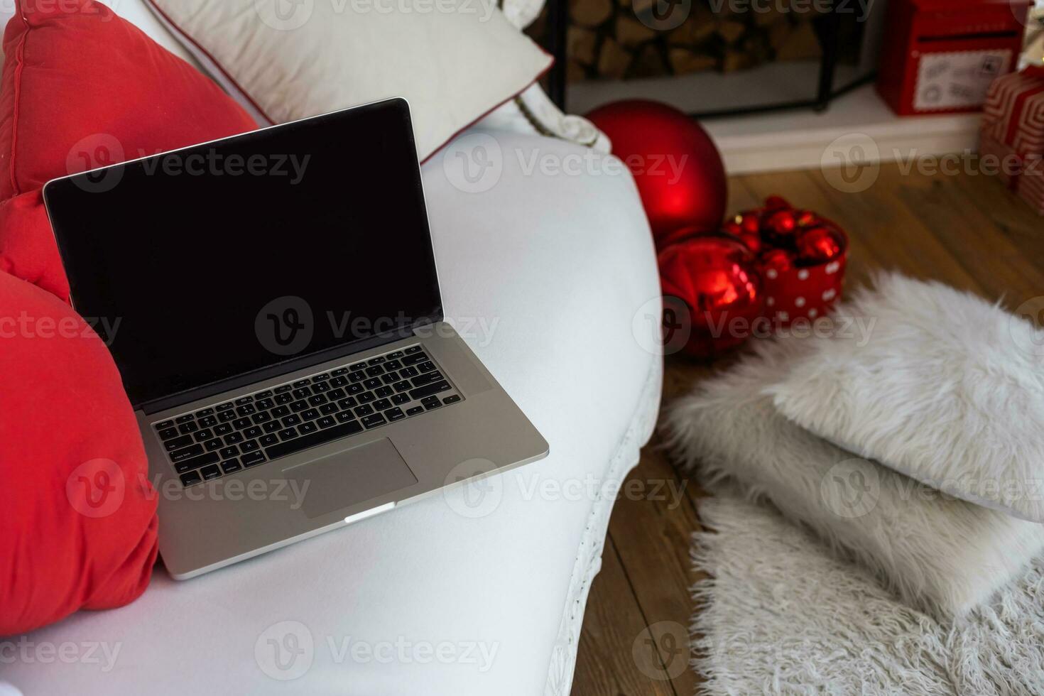 Christmas decorated working space with a laptop on the desk, social media holiday concept with blank space for a text photo
