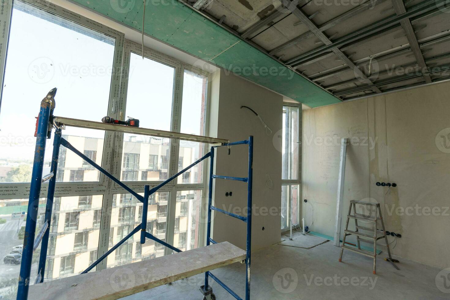 The metal frame of the ceiling, sound insulation, in the process of repairing an apartment photo