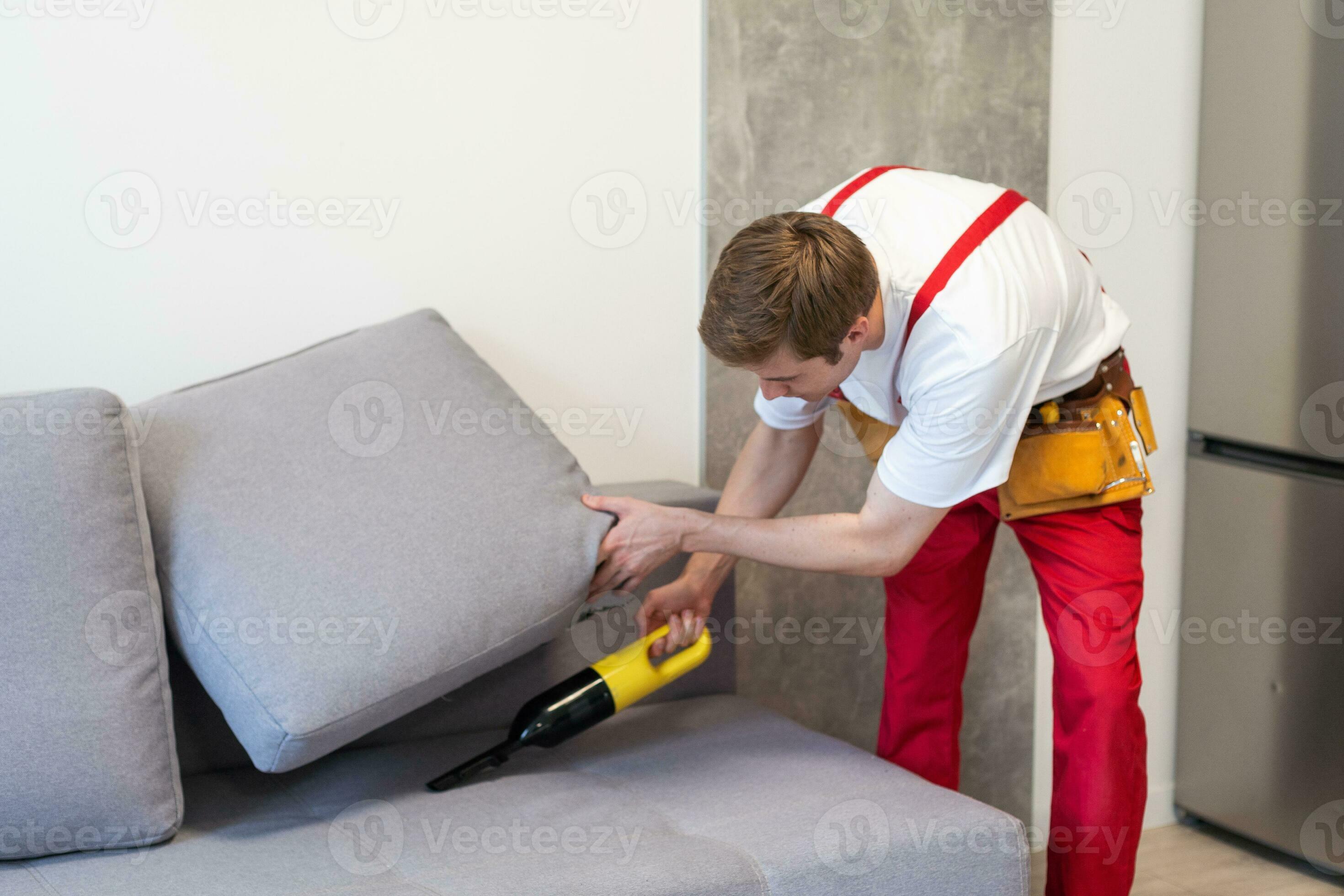 Dry Cleaners Employee Hands In Rubber Protective Gloves Removing