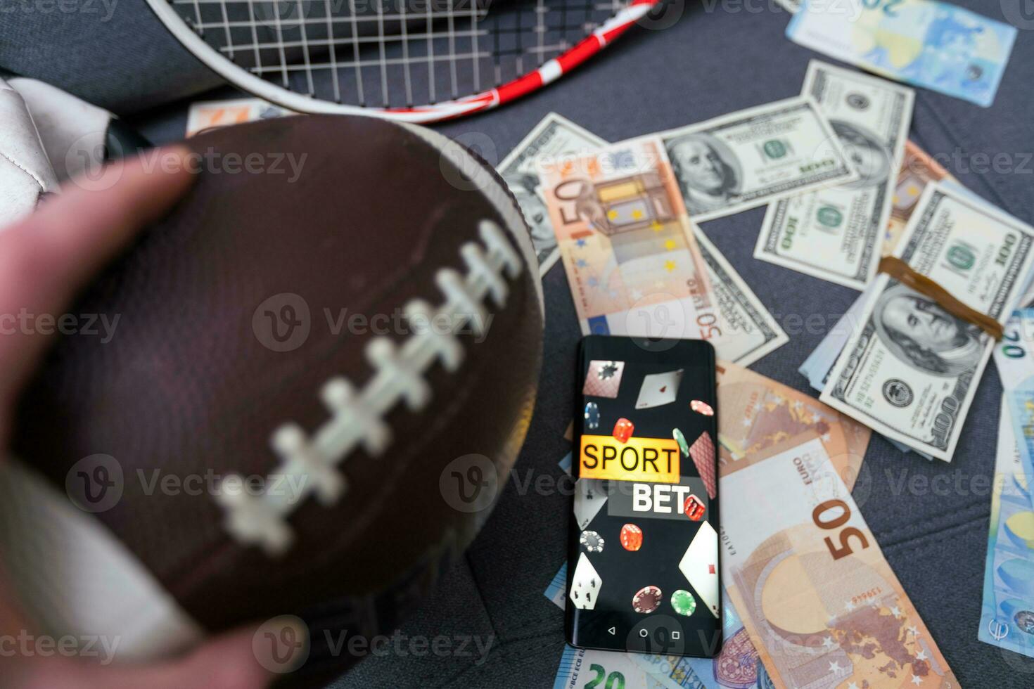 betting on sports, smart phone with working online betting mobile application photo