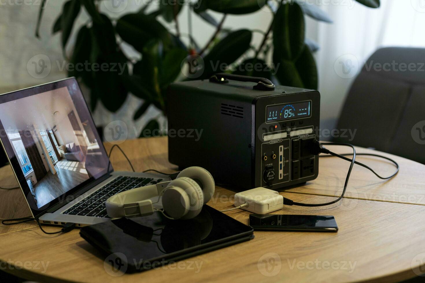 Portable power station solar electricity generator laptop, phone, tablet and digital camera electronic devices charging. Wireless charging battery backup, power outage emergencies outdoors, camping photo