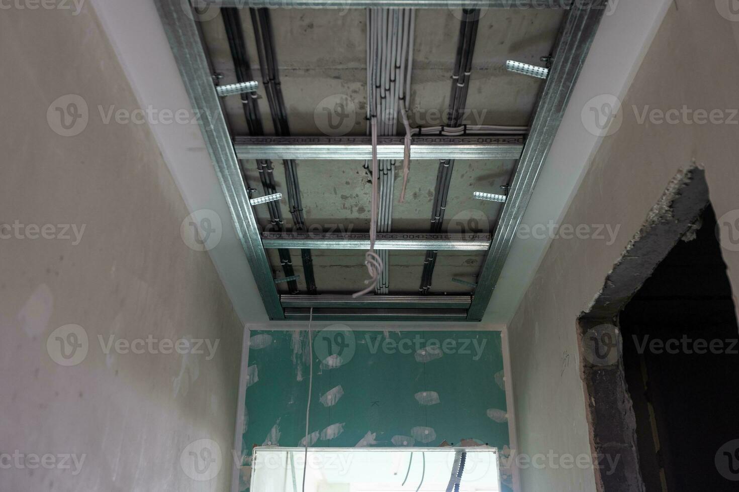 The metal frame of the ceiling, sound insulation, in the process of repairing an apartment photo