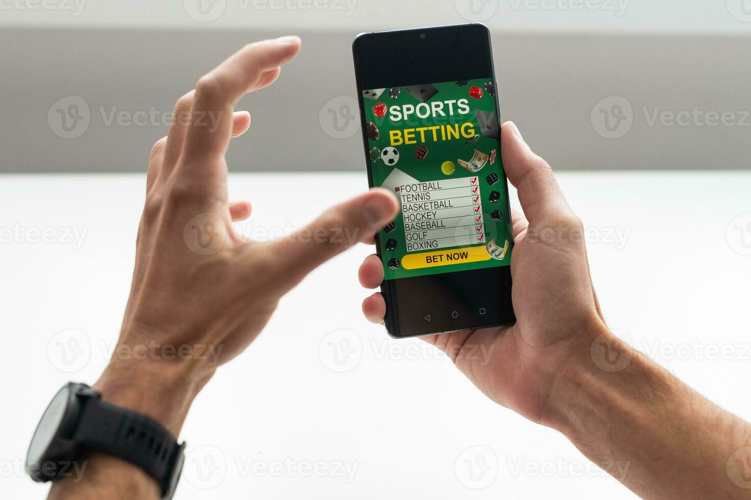 Businessman using smartphone against gambling app screen photo