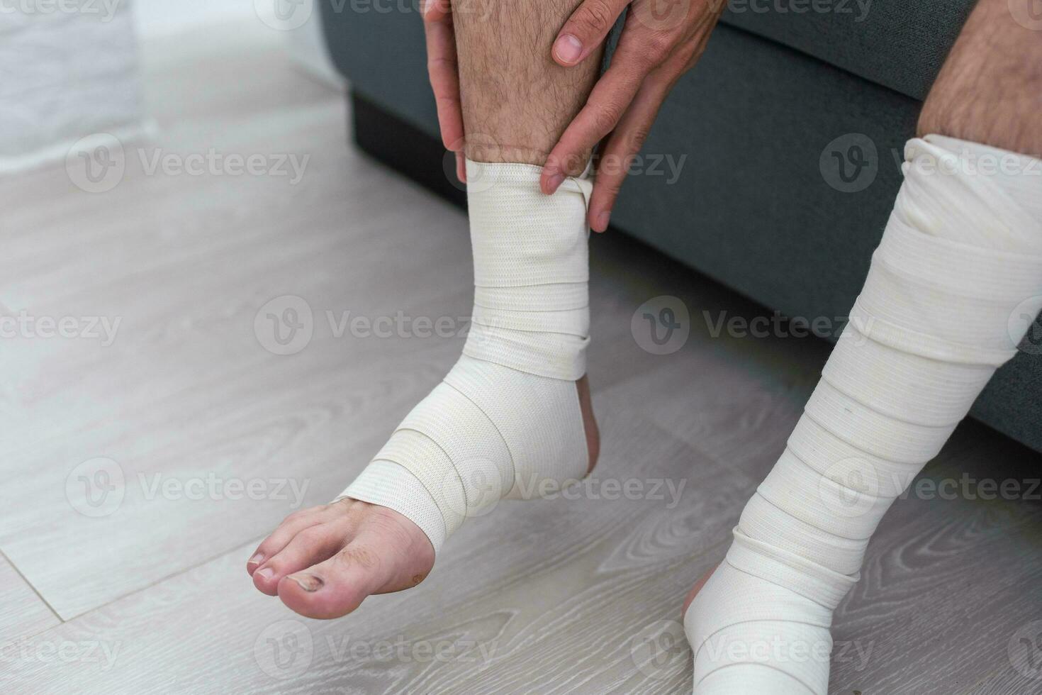 the man's leg is wrapped in an elastic bandage photo