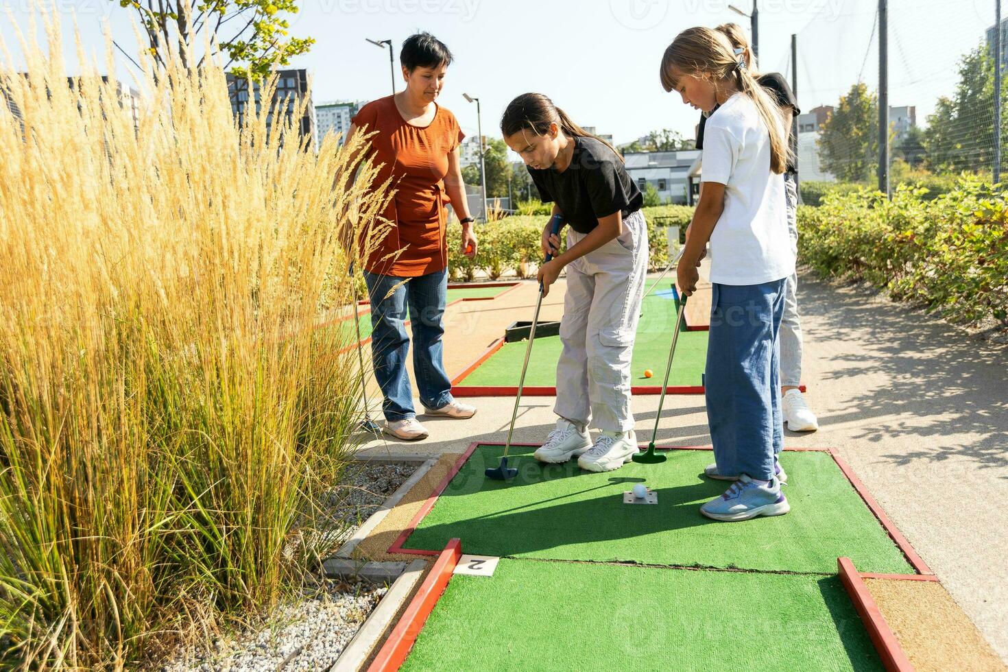 Golf course group of friends people with children posing standing photo
