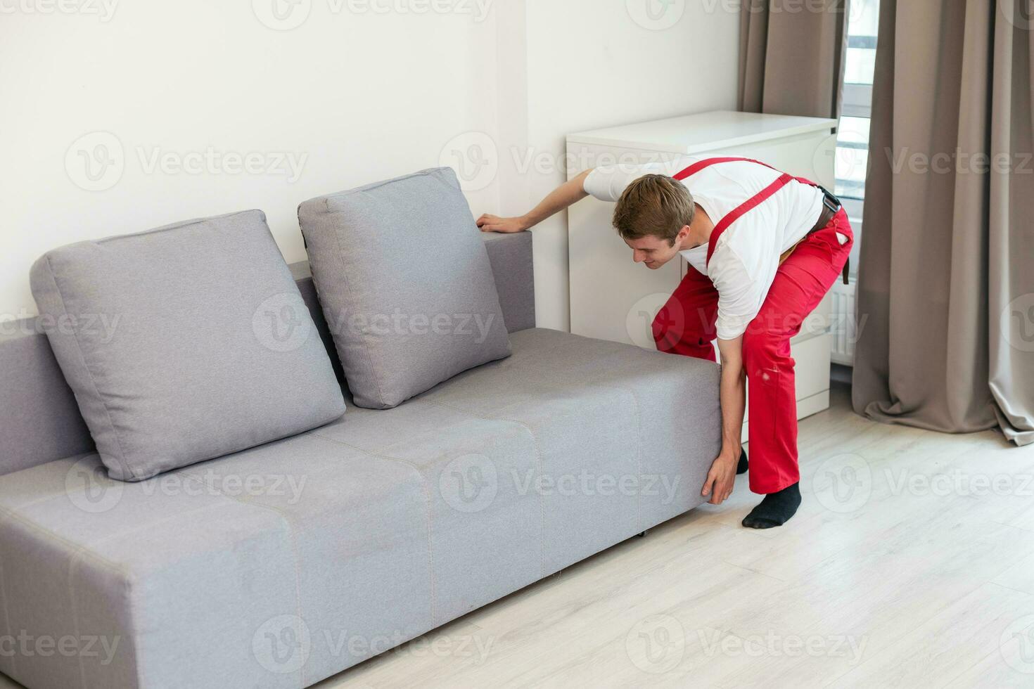 Man assembling sofa furniture at home photo