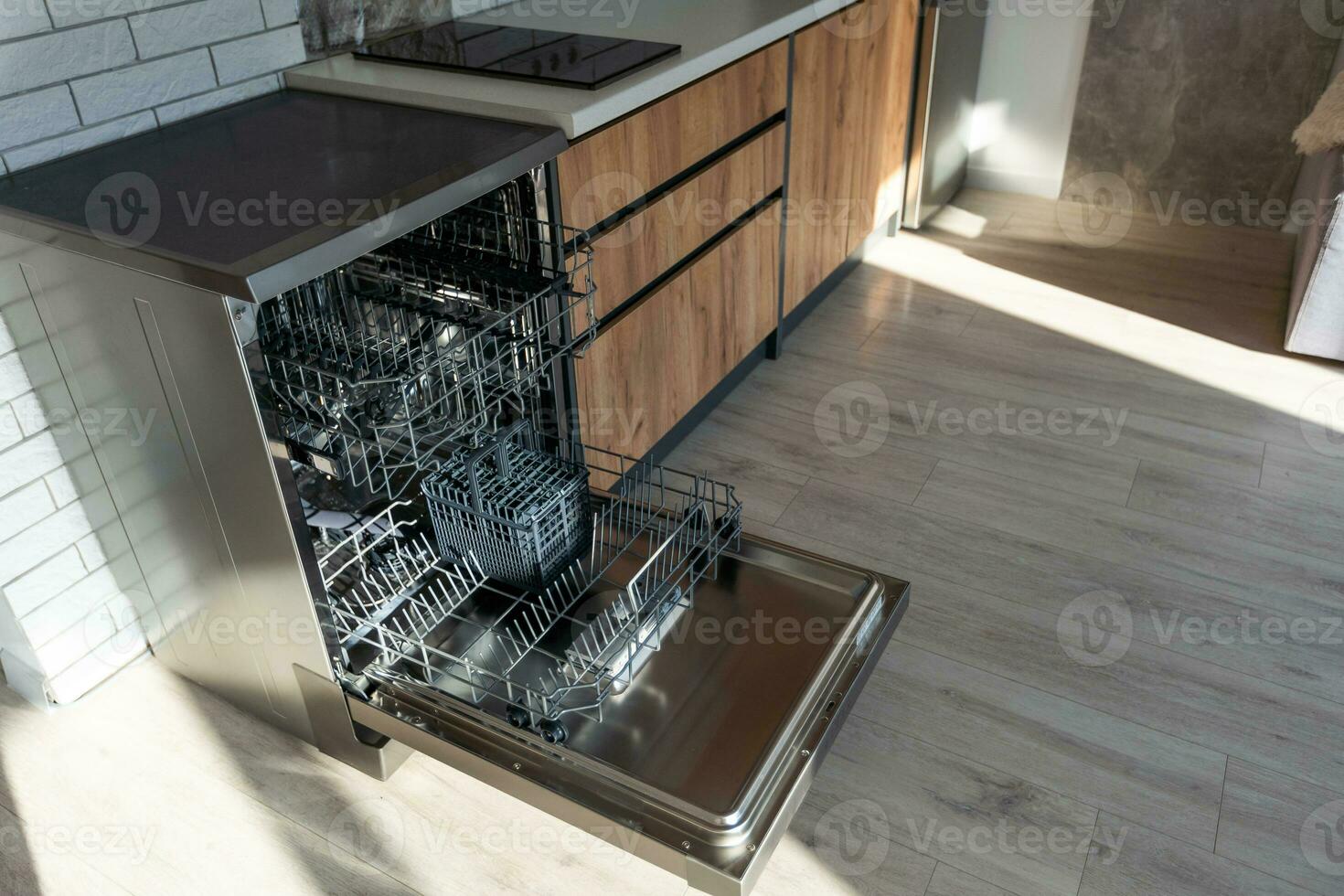 Dishwasher in modern kitchen. Perfectly washing dishes photo