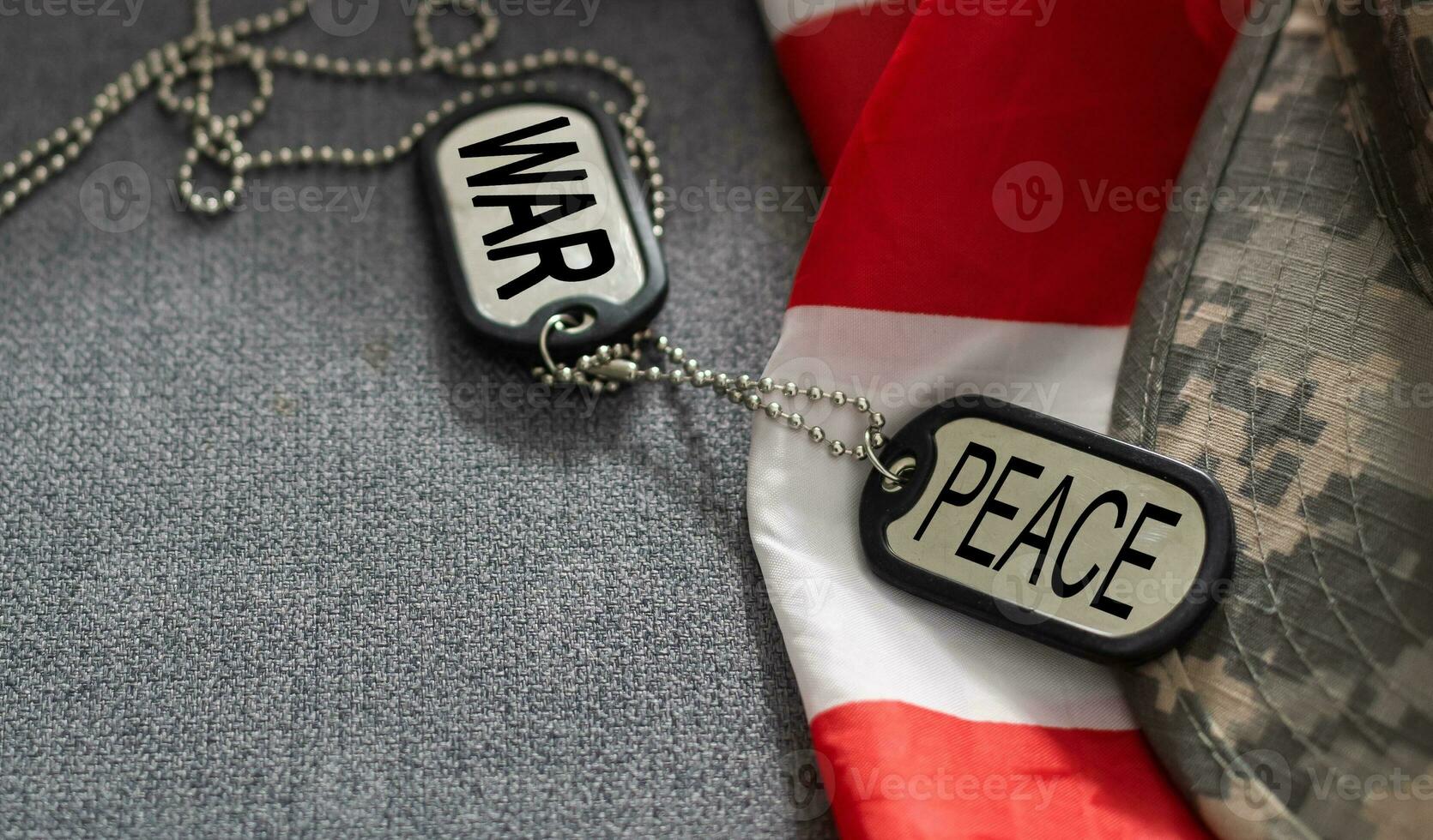 army blank, dog tag with text war peace on the khaki texture background. military concept photo