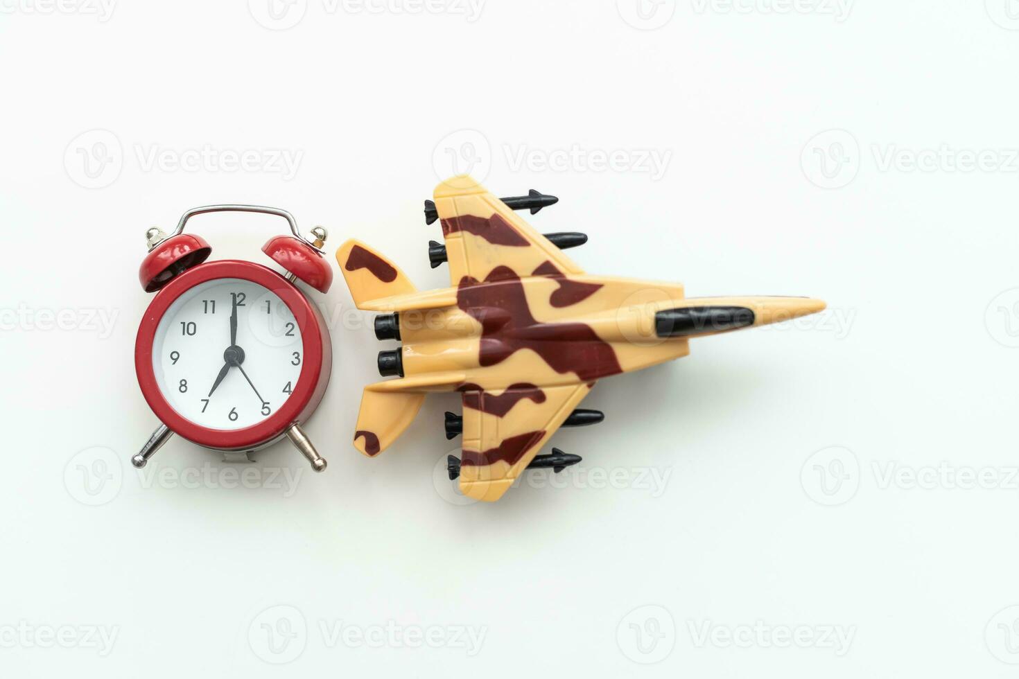 Airplane toy with alarm clock on blue. Time to flight. photo