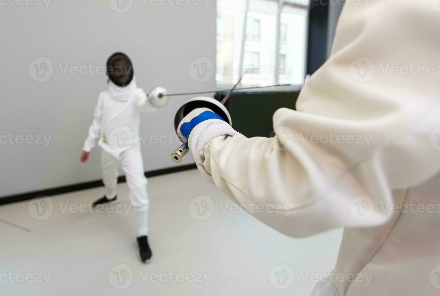 Junior Girls at a foil fencing tournament photo