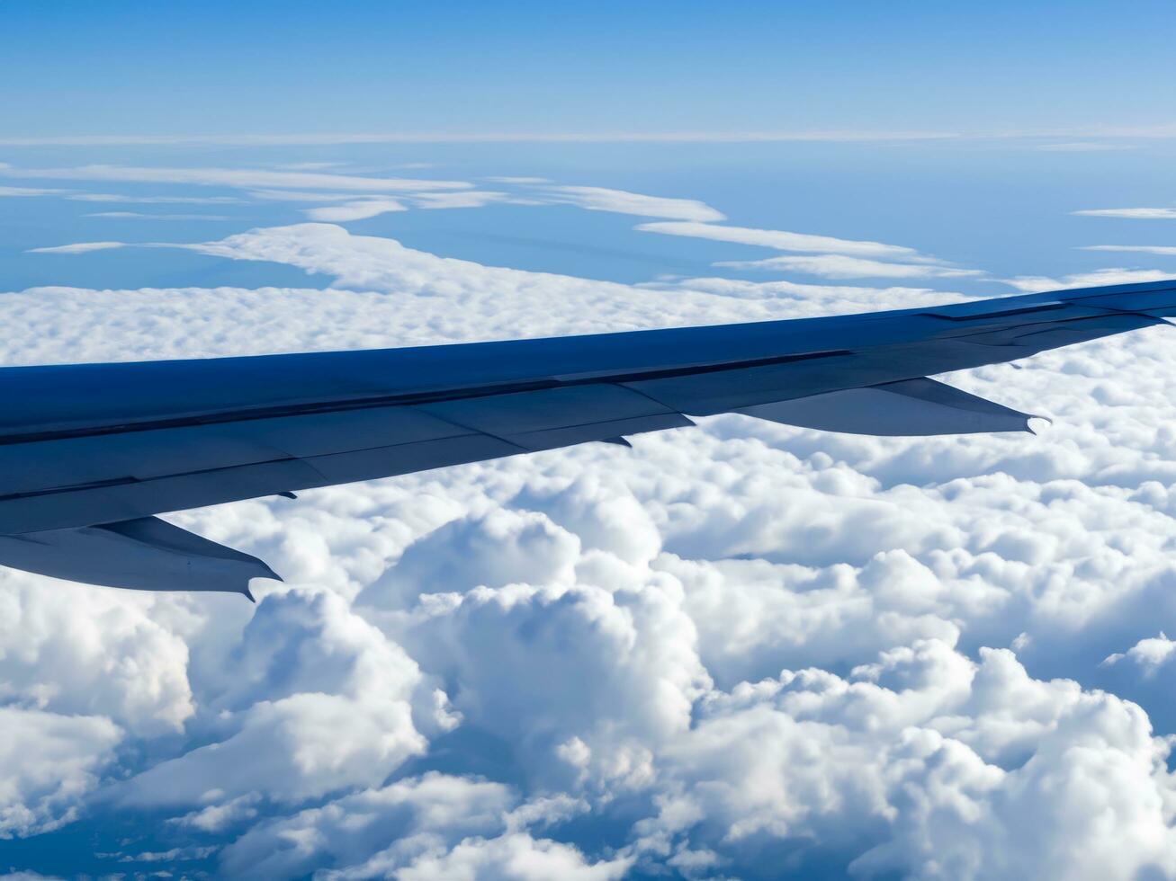 view from airplane with clouds and airplane wing AI Generative photo