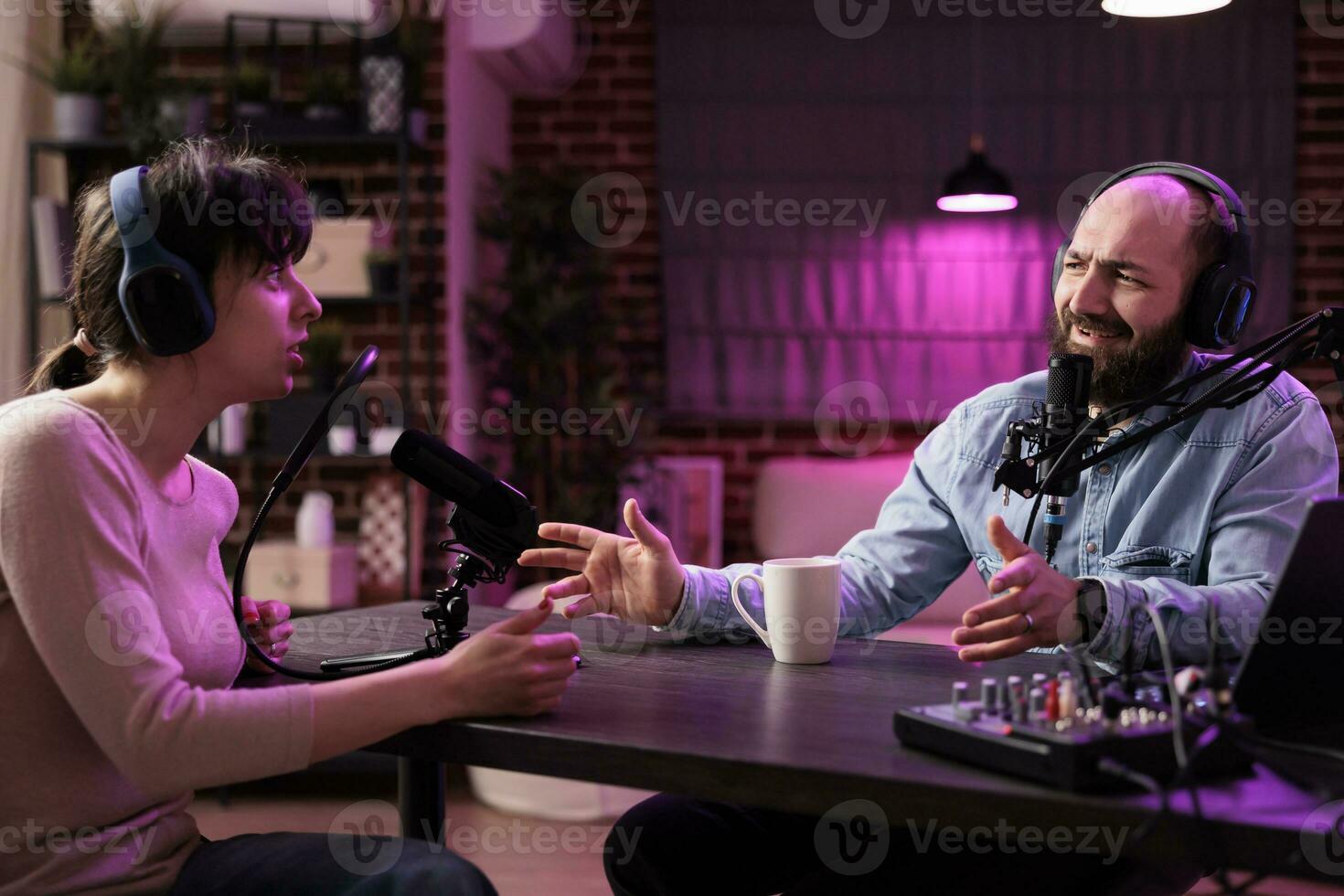 Show host interviewing woman during live stream, talking about fashion and style trends, disagreeing with her opinions. Man arguing with social media celebrity, recording podcast photo