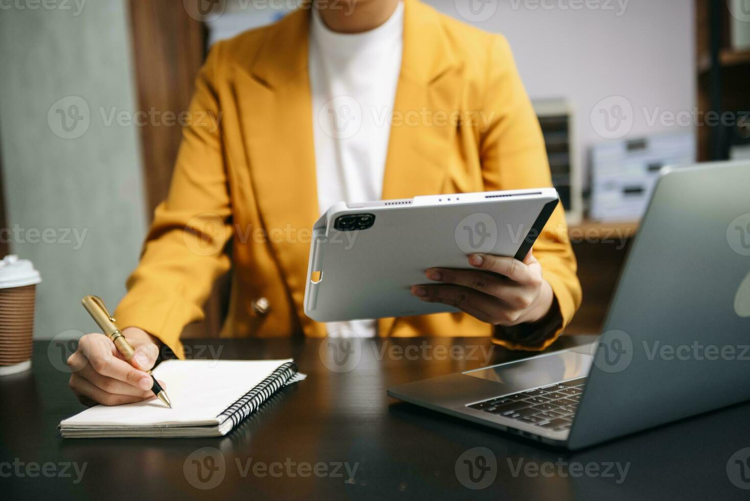 businesswoman hand working with new modern computer and writing on the notepad strategy diagram as concept photo