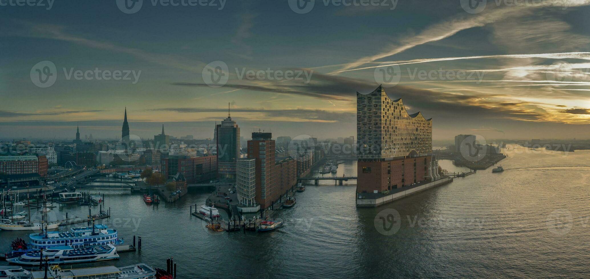 Panorama of the Elbphilharmony, Hafencity and Speicherstadt in Hamburg at sunrise photo