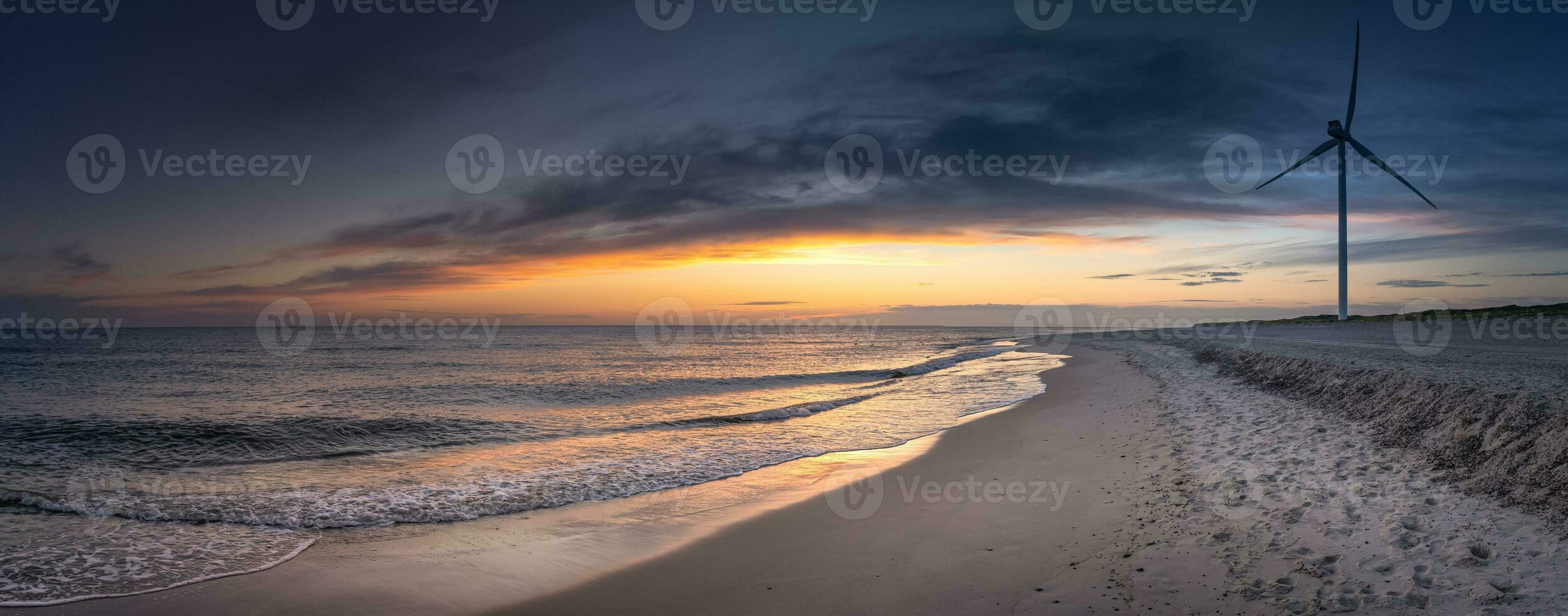 Panorama from a sunset at the beach photo