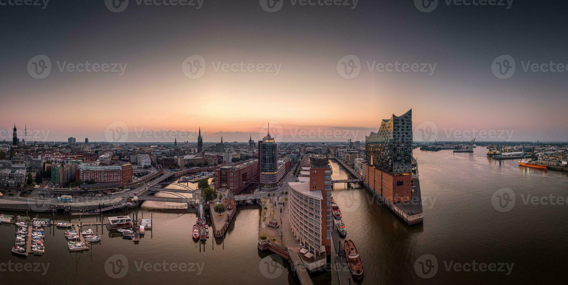 Panorama of the Elbphilharmony, Hafencity and Speicherstadt in Hamburg at sunrise photo